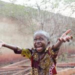 Child under the rain in Mali (photo by Riccardo Mayer).